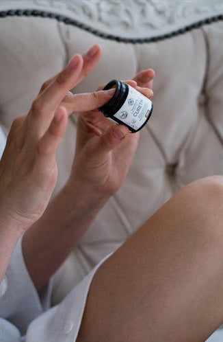 CURETIK Deep Moisturizing Ointment 30 ml jar labeled celandine yarrow olive oil beeswax