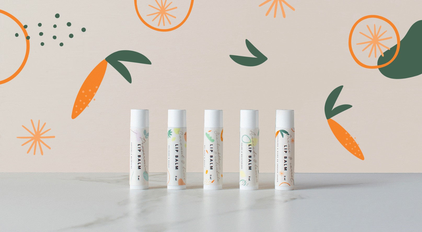 Orange & Carrot Lip Balm 5ml tube showing orange-tinted balm with beeswax and cocoa butter texture