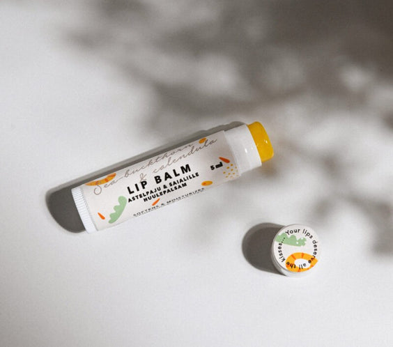 Sea-Buckthorn & Calendula Lip Balm 15 ml tube showing beeswax cocoa butter texture and natural oil color