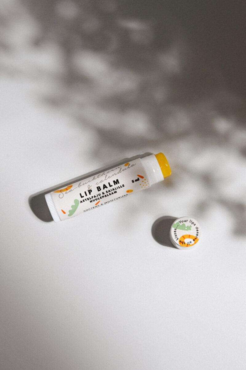 Sea-Buckthorn & Calendula Lip Balm 15 ml tube showing beeswax cocoa butter texture and natural oil color